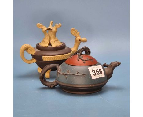 Two Yixing coloured ware tea pots, one with a chicken head spout and triple chicken cover finial