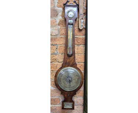 A mahogany banjo barometer by Durran, Banbury with an alcohol thermometer above the dial and spirit level