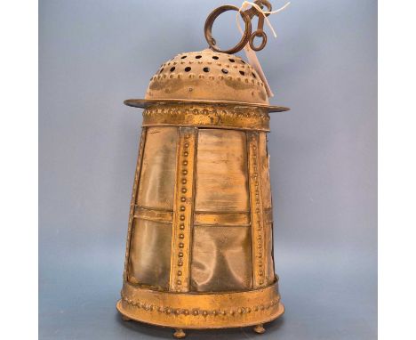 An Arts and Crafts brass lantern, the domed top pierced between three bands of raised cabochons, the sides flaring to the cir
