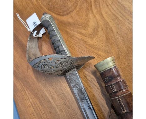 A George V officer's sword by Henry Wilkinson with an etched blade and leather mounted scabbard