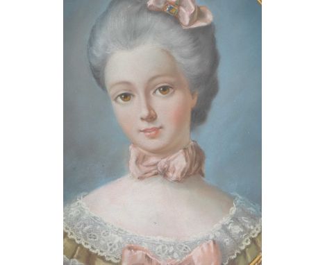 French school, an oval portrait of an 18th century brown eyed lady adorned with pink bows, pastel. 39 x 31cms.