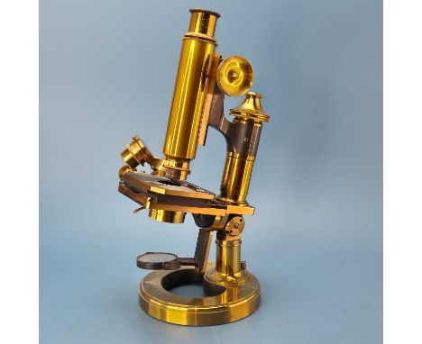 A Ross-London "Eclipse" brass monocular microscope numbered 6072. in a fitted mahogany case