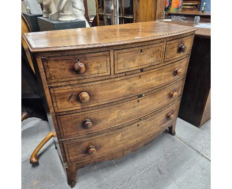 An ebony line inlaid mahogany bow front chest of three short and three graded long drawers on bracket feet H 106 W 116 D 57 c