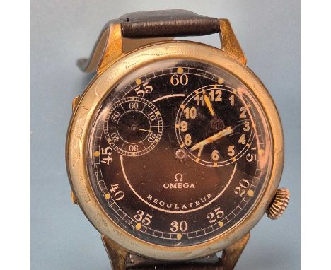 An interesting Omega Regulateur pocket watch, adapted as a jumbo wrist watch. Black dial with luminous markings, centre minut