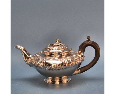 A Victorian silver teapot by Pearce and Burrows, London 1838, the shoulders and hinged cover embossed with flowers, 339 grams