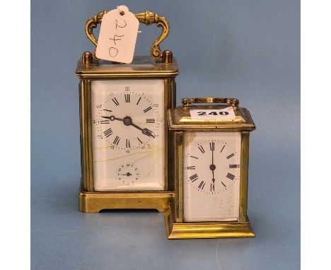 An alarm carriage clock striking on a bell.   H 12cms. together with a carriage timepiece.   H 10cms.