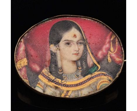 An antique Indian portrait miniature brooch on an ivory panel. Inscribed verso, daughter of the King of Lucknow? (probably Be