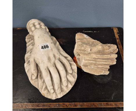 Plaster casts of a sandled foot, a lady's hand and an architectural moulding