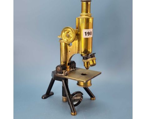 An antique brass monocular microscope By J. Swift &amp; Son, London. with twin objective lens.