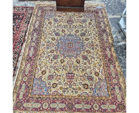 An oriental rug of Persian Tabriz design 217 x 150 cm