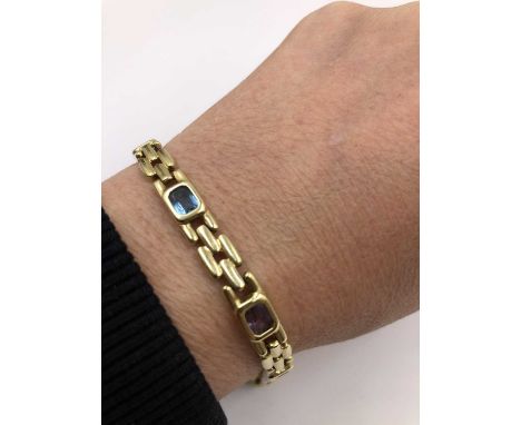 A multi gem set contemporary bracelet. Stamped MG 14k, assessed as 14ct gold. Length 18 cm. Weight 16.70 grams. 