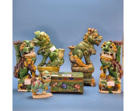 A pair of Chinese spinach and egg glazed Buddhist lions. H 19cms. three other green glazed lions and a green ground cloisonne