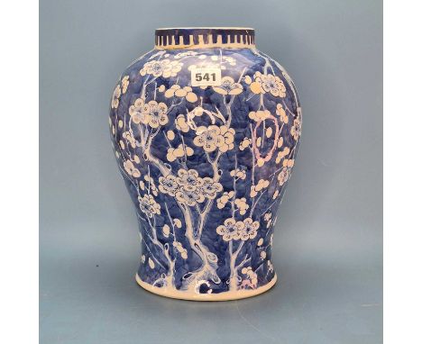 A Chinese blue and white baluster jar painted with prunus flowering on a cracked ice ground, six character mark. H 30cms. tog