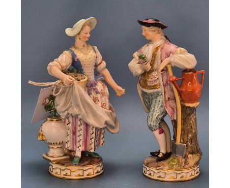 A pair of Meissen lace trimmed figures of a gardener and of his wife with a basket of flowers, crossed swords marks.   H 18cm