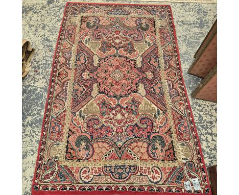 An unusual antique Persian sarouk rug. 215 x 130 cm.