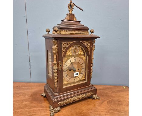 An ormolu mounted mahogany twin fusee mantel clock striking on a bell, a strike/silent indicator in the arch above the silver