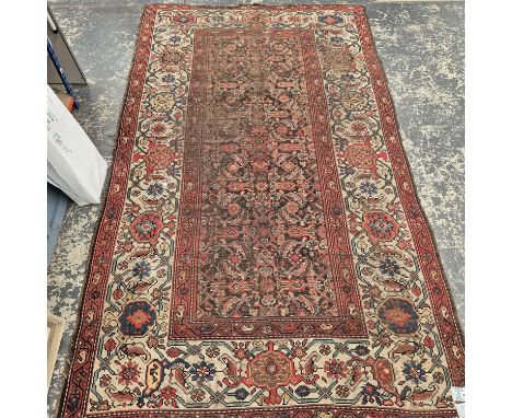 An antique Persian tribal rug 285 x 158 cm