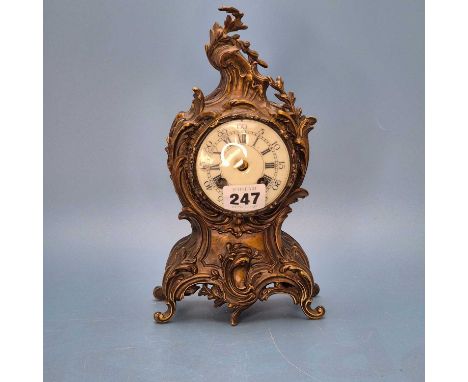 A rococo foliate ormolu cased mantel clock striking on a bell.   H 24cms. 