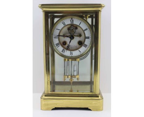 SAMUEL MARTI A BRASS FOUR-GLASS MANTEL CLOCK, white enamel dial with Roman numerals, recessed centre with visible Brocot esca