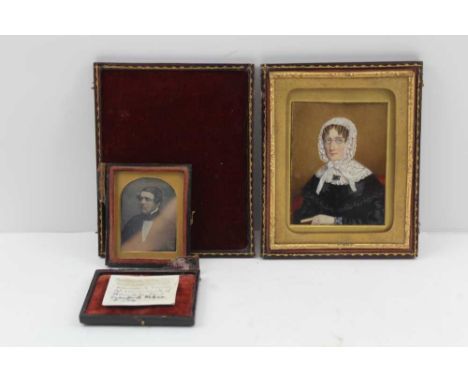 A VICTORIAN MINIATURE PORTRAIT PAINTING, a lady in black with a white lace bonnet, wearing spectacles, 9cm x 7cm in leather c