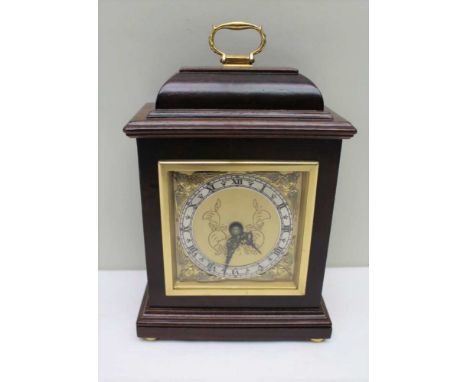 AN ELLIOT OF LONDON MANTEL CLOCK, polished case with brass handle to the top, square brass face with silvered chapter ring ha