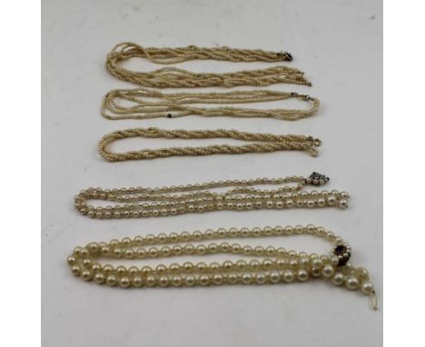FIVE CULTURED PEARL NECKLACES&nbsp;including; one with an 18ct white gold diamond mounted clasp and one with a 9ct gold ameth