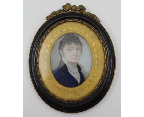 A REGENCY PERIOD MINIATURE PAINTING ON IVORY, portrait of John Harrison, c.1820, head and shoulders, wearing a blue jacket wi