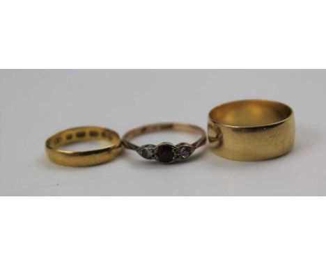 A BROAD PLAIN 18ct GOLD WEDDING BAND, size; 'M 1/2' a small 22ct GOLD WEDDING BAND size; 'H' and a RUBY &amp; DIAMOND SET RIN