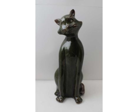 A STUDIO POTTERY LOUIS WAIN STYLE CAT, green glazed stoneware in seated position, 39cm high 