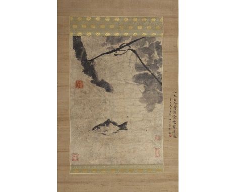 A Chinese hanging scroll, 20th century, in the style of Bada Shanren, of a fish in a lotus pond, inscribed, ink and colour on