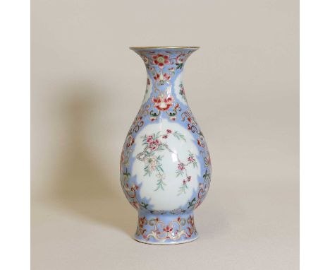 A Chinese famille rose vase,Republic period (1912-1949), the pear-shaped body rising from a tall flared foot, painted with bl