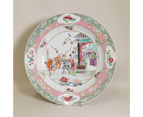 A Chinese famille rose charger,18th century, the rounded sides rising from a circular foot, the centre painted with figures i