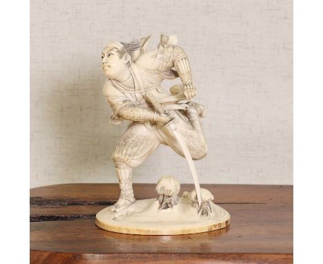 A Japanese ivory okimono,Meiji period (1868-1912), carved as Horibe Yasubee Taketsune (1670-1703) running in the snow with hi