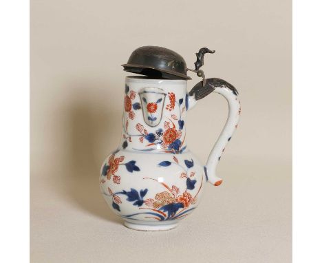 A Chinese Imari chocolate pot, 18th century, the globular body rising to a cylindrical neck with a funnel spout, flanked by a