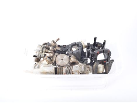 Plastic box containing engine parts, mounts, etc.
