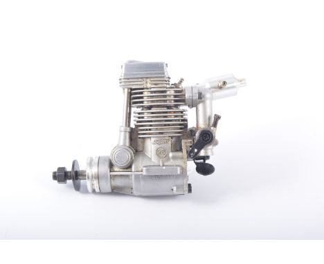 OS FS 26 R/C glow engine used, in box with papers.
