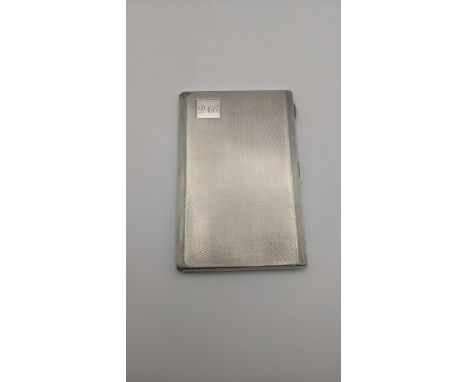 A Gladwin Ltd silver cigarette case having an engine turned design and a gilt interior hallmarked Birmingham 1936, 191.4g Loc