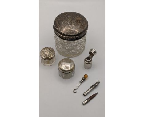 Three dressing table pots having silver lids, together with a silver button hook, scent bottle and othersLocation:If there is