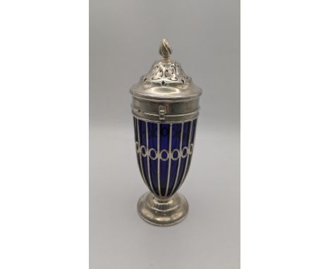 A Haseler Brothers silver sugar caster hallmarked London 1900 with a pierced lined body and a blue glass liner, weight exclud