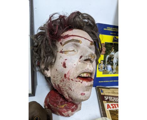 A mixed lot of ephemera, books, TV related and props department items to include a severed head, 33rpm TV 21 Themes record, a
