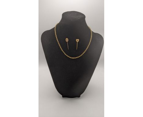 A 9ct gold chain, 39cm l, together with two 9ct gold stick pins, one set with a ruby and the other a ruby coloured stone, tot