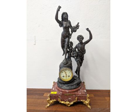 A Late 19th century French Spelter marble mantle clock surrounded by two figuresLocation:If there is no condition report show