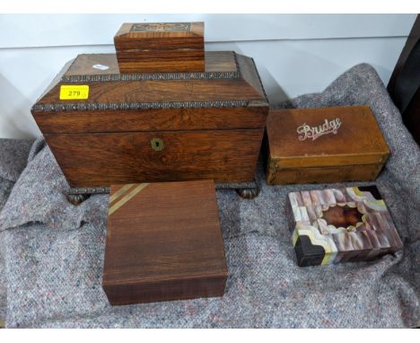 A tea caddy of sarcophagus form and four boxes, one with mother of pearl inlay, one with hinged lid and metal banding one wit