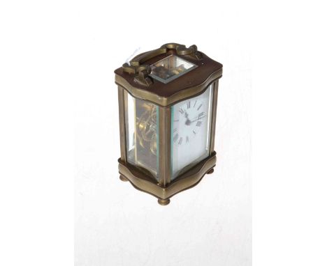 French gilt brass carriage clock with serpentine sided frame.