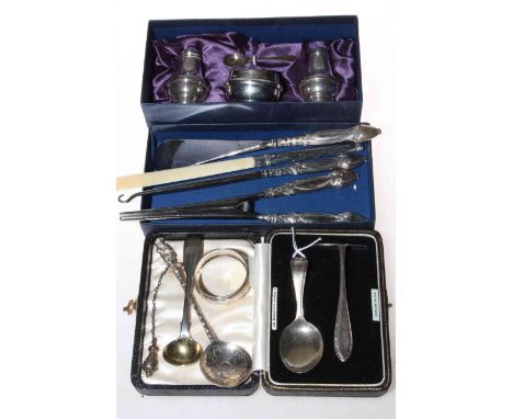 Collection of silver items including cruet set, glove stretchers, shoe horn and button hook, page turner, spoons, etc.