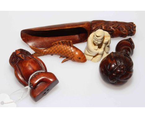 Three carved wood netsuke, owl, gourd with mask and carp; carved scoop and small figure (5).