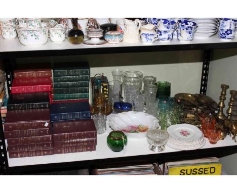 Shelf assortment of books, glass, ceramics and metalwares.