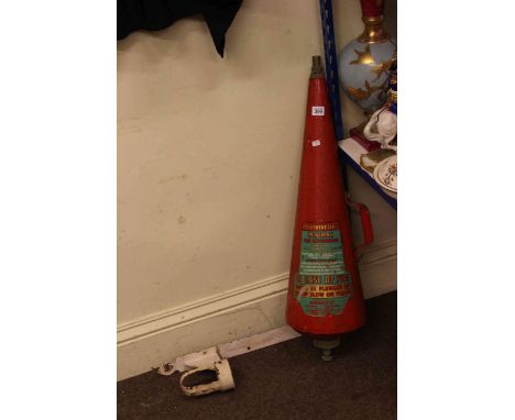 Vintage fire extinguisher and wall bracket.
