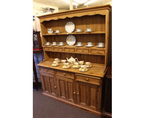 Pine three door dresser with shelf and spice drawer back.