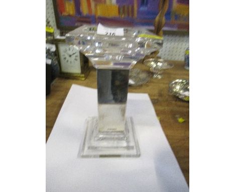 A modern hallmarked silver and glass candlestick